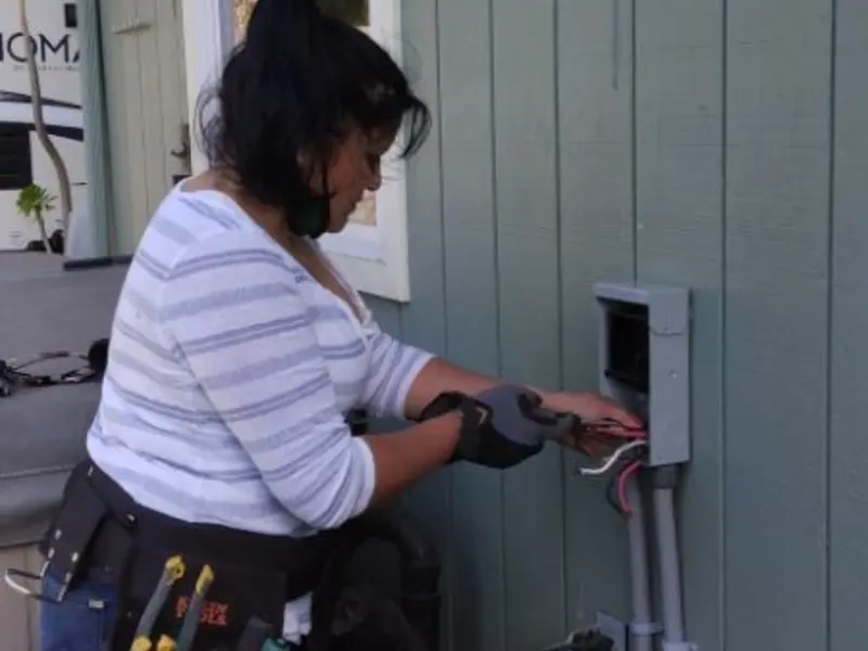 Licensed electrician wiring an exterior subpanel in Camp Verde